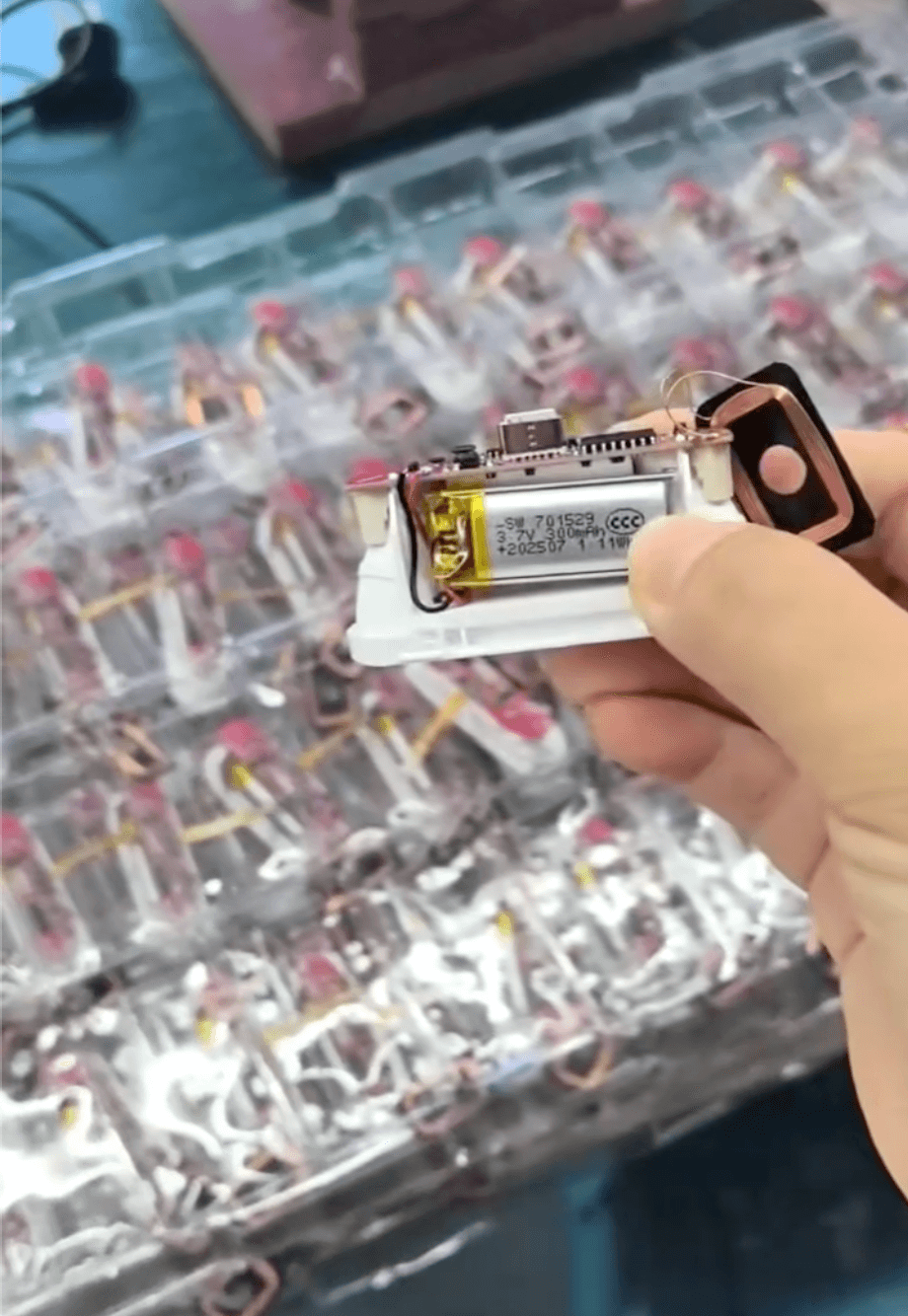 The internal structure of AirPods, including the main board, battery and wireless charging pad